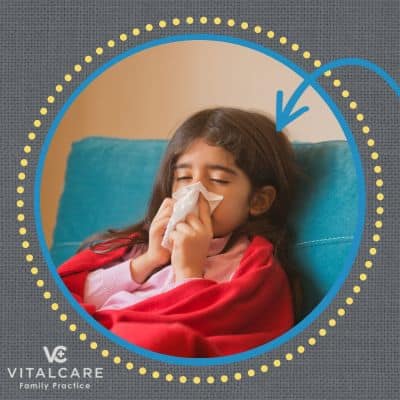 Should my sick child miss school? 1 Little girl blowing her nose in a tissue, representing sick child